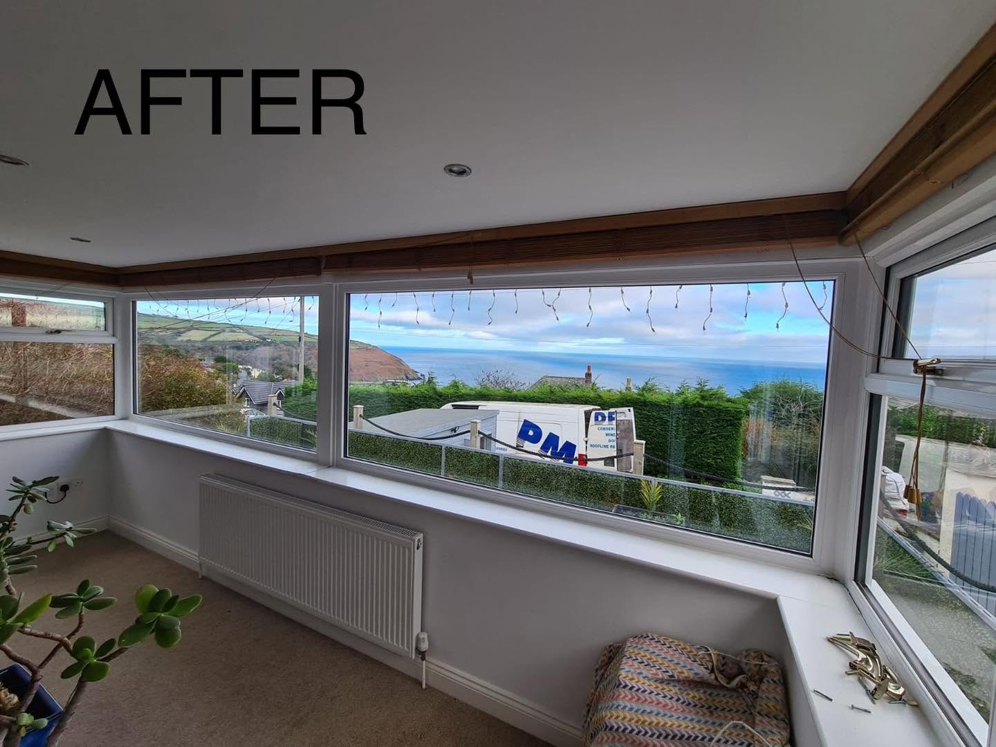 White windows with larger panes overlooking the coast, labelled AFTER in the original photograph
