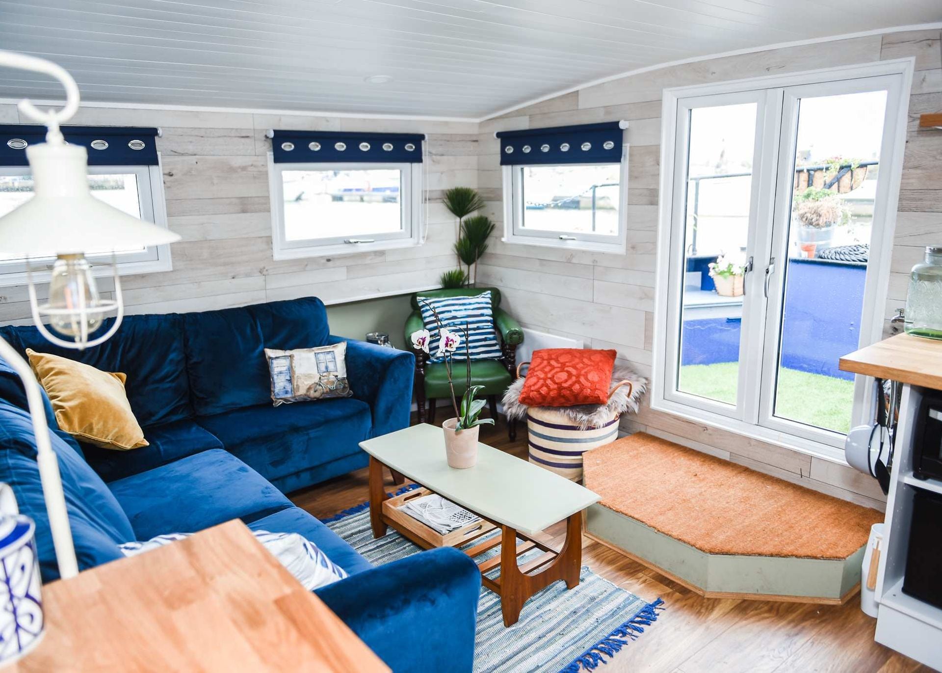 A bright glazed room opening onto the garden